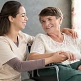 A support worker listening to an older participant