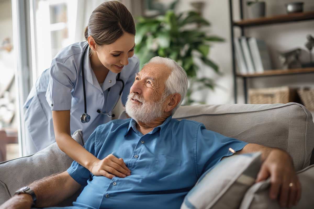 A support worker reassuring an older participant at home